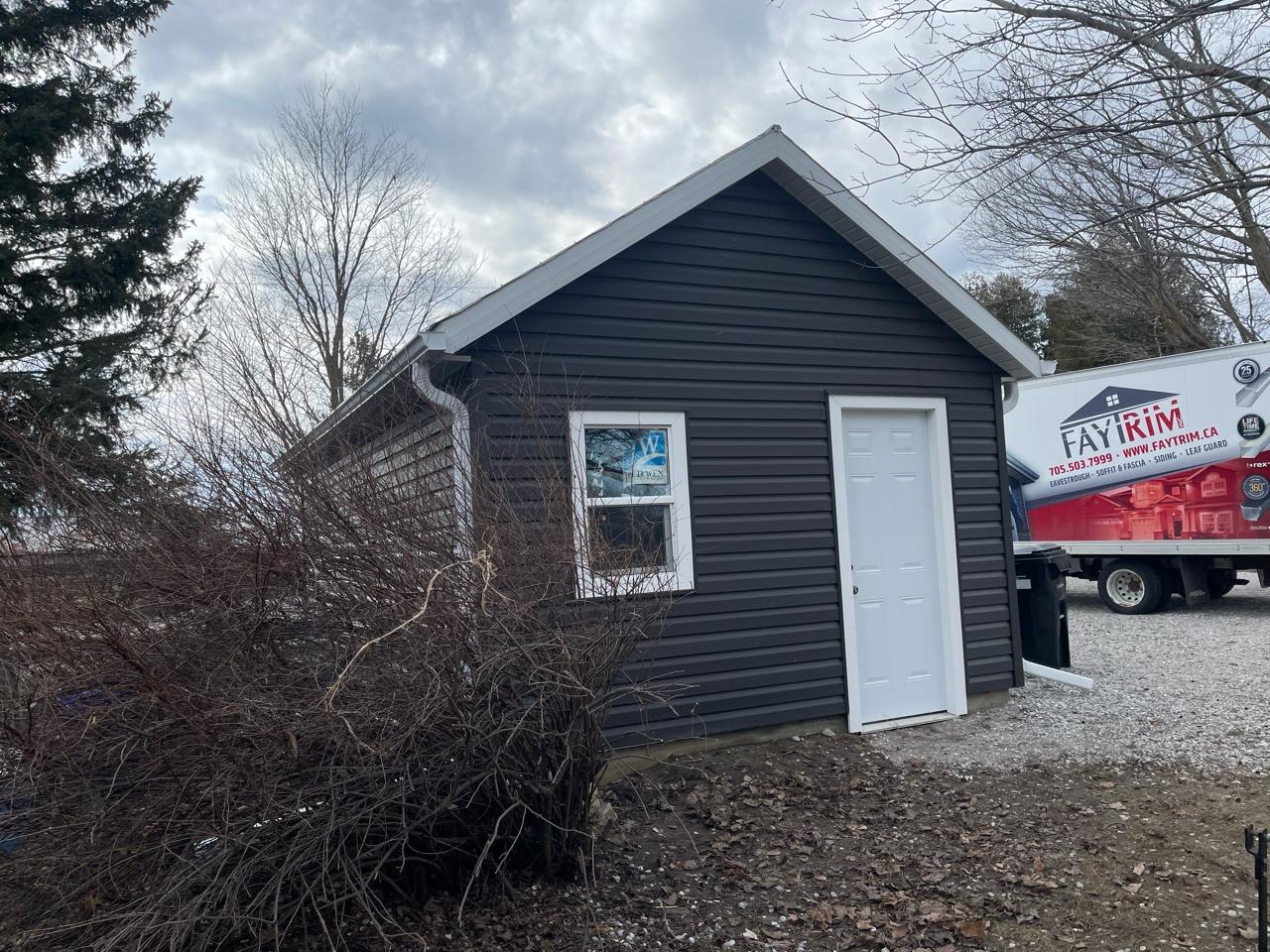 Vinyle siding on a shed project by FayTrim